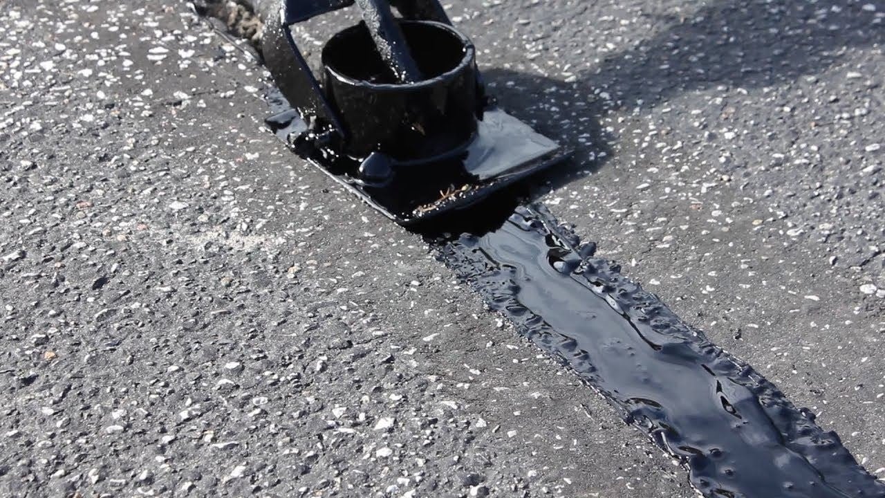 Smooth black asphalt coating finish